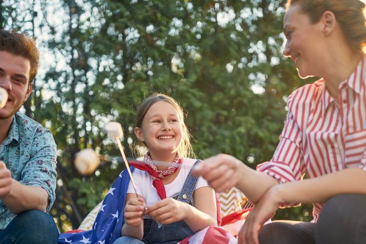 family making s'mores on 4th of july