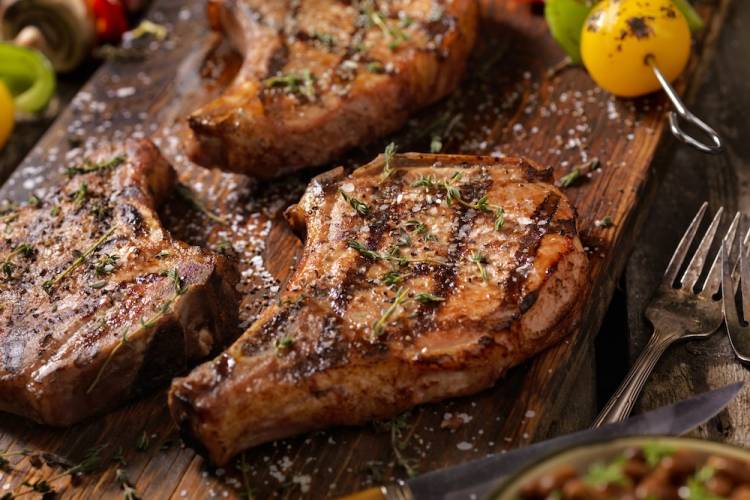 pork chops on a cutting board