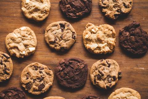 aerial view of an assortment of cookies on a wooden counter top